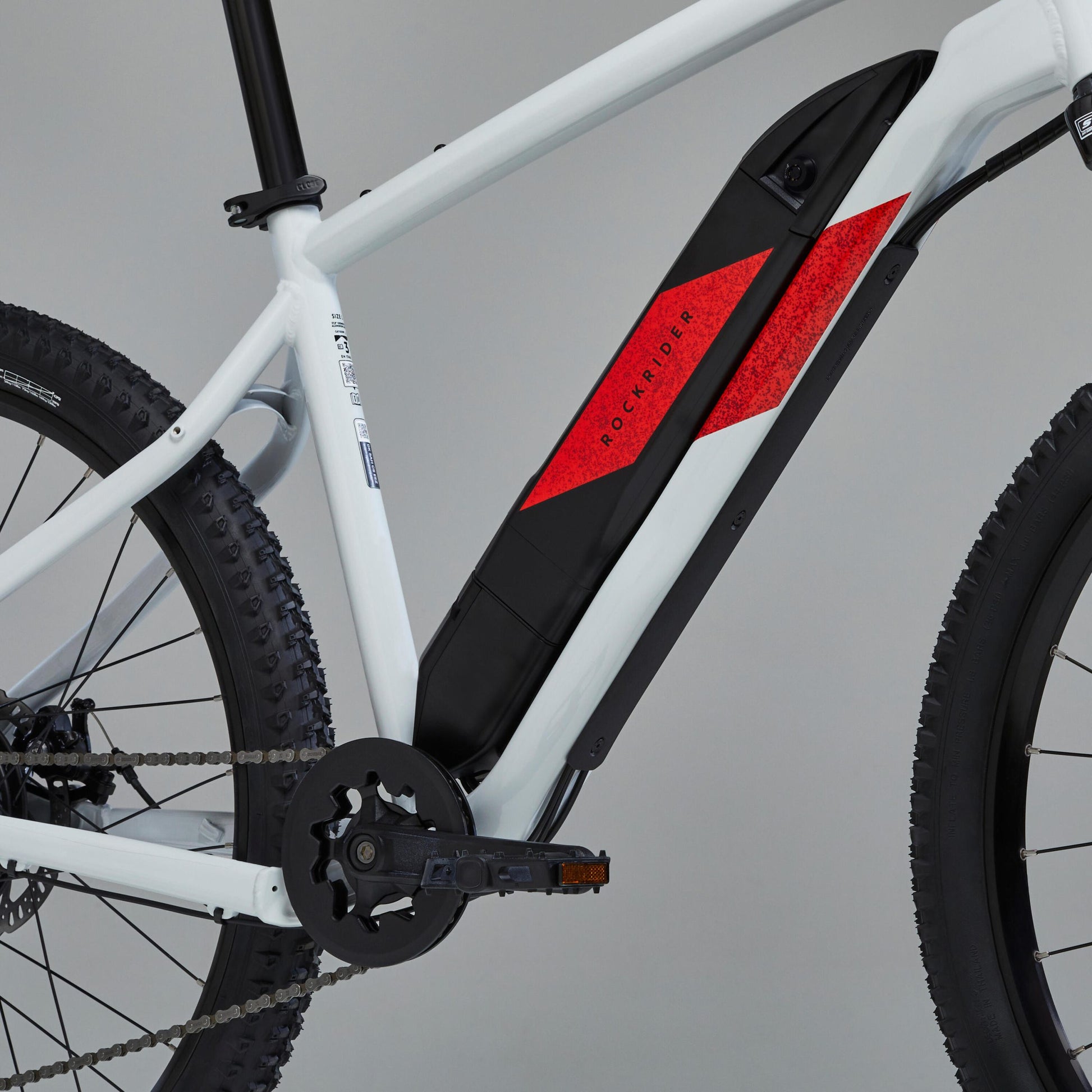 bicicleta eléctrica de montaña Rockrider E-ST 100 Blanco/Rojo 27,5″ con batería de 380 Wh